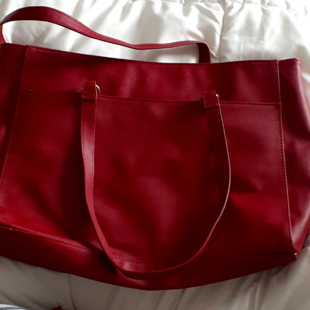 Red tote perfect for work. Has 6 pockets and a laptop pocket.